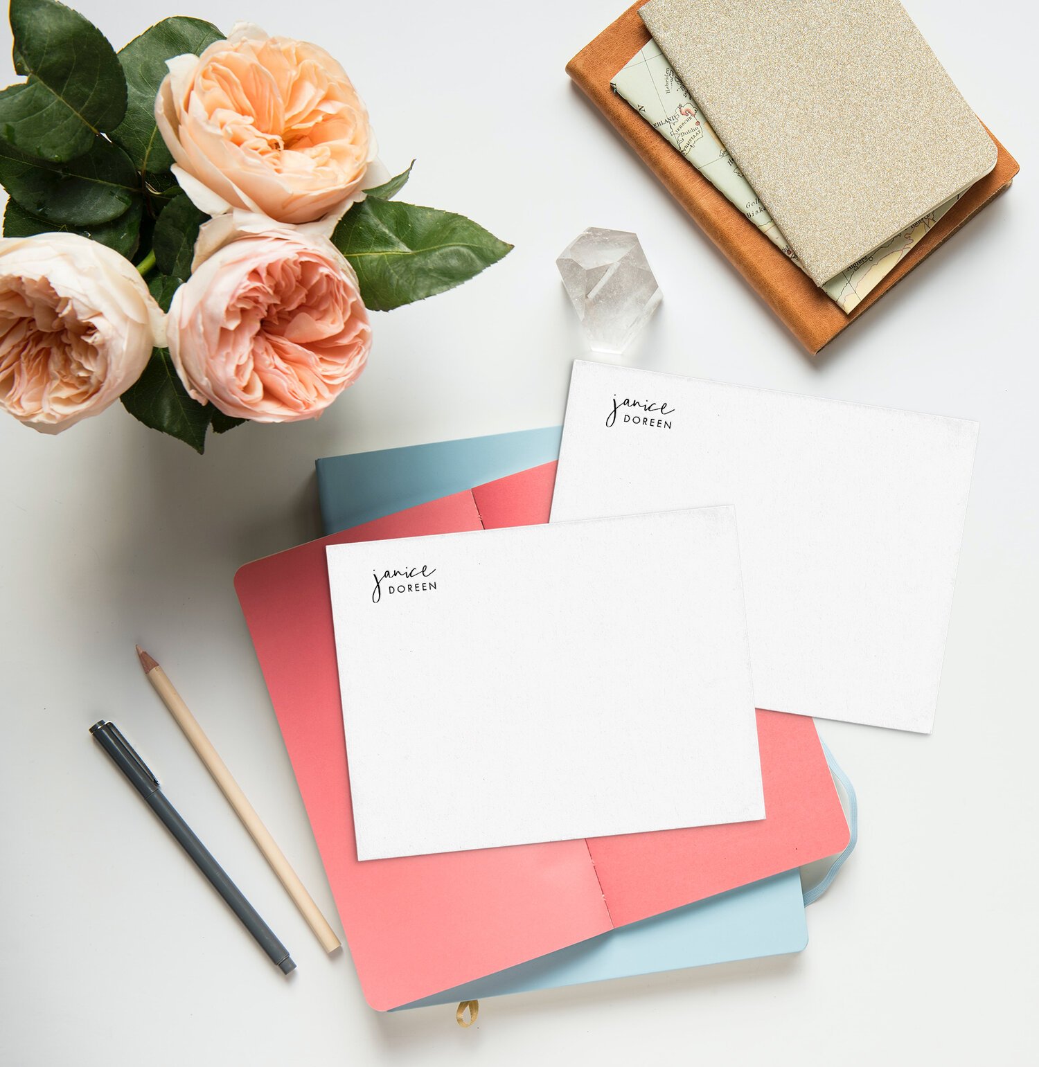 Letterpress floral card with black envelope on marble