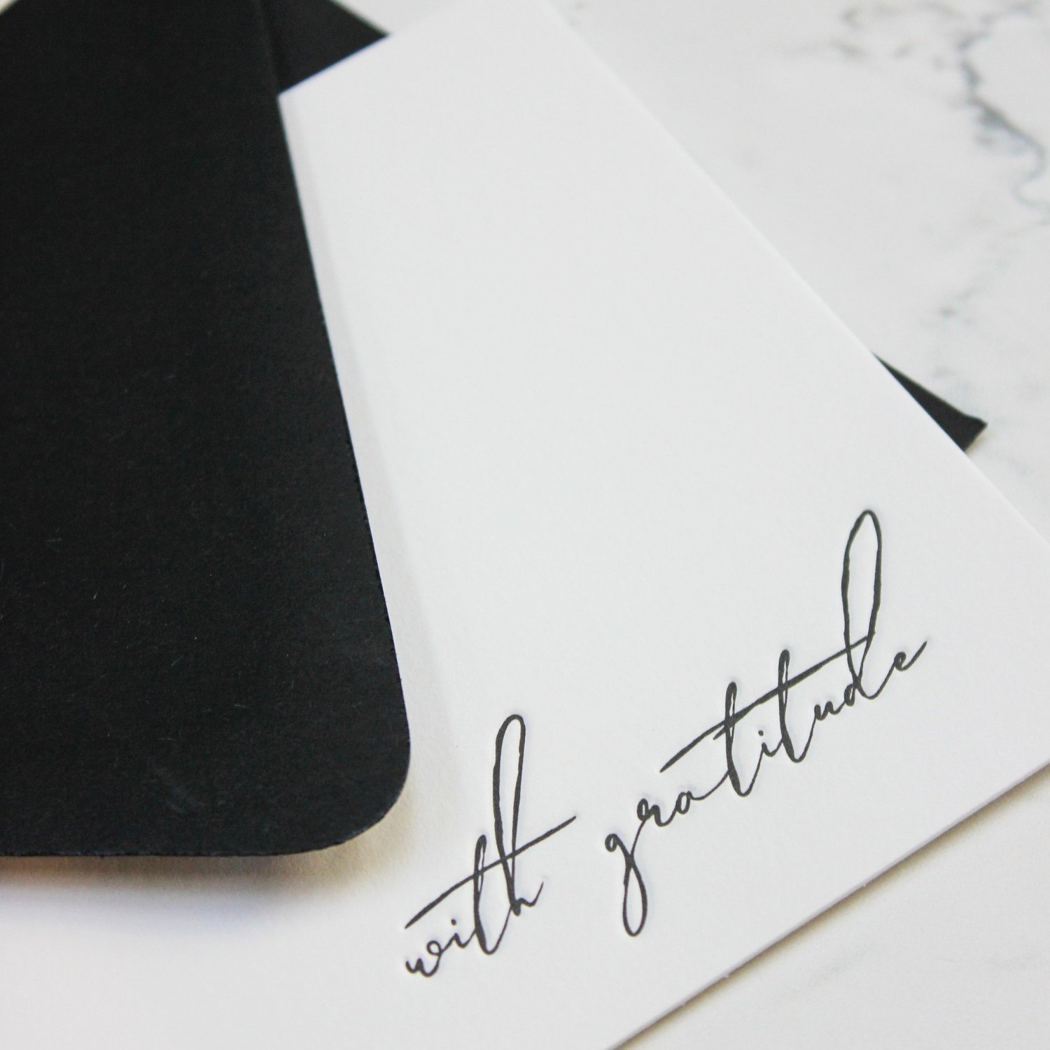 Script letterpress card with black envelope