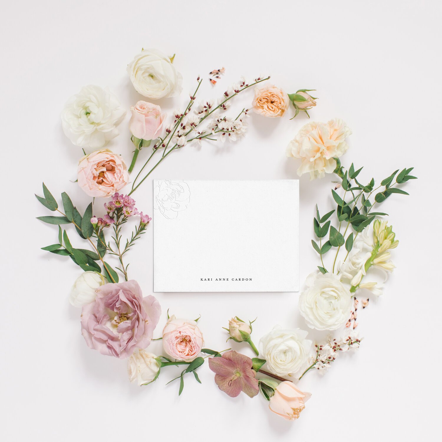 Personalized letterpress note card framed by a wreath of flowers