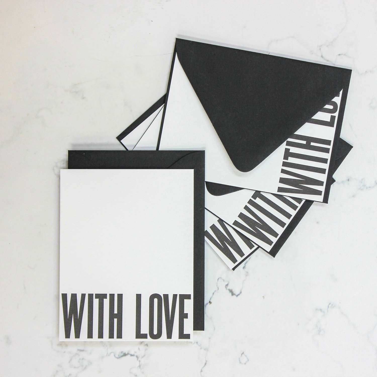 With Love letterpress cards and black envelopes, overhead